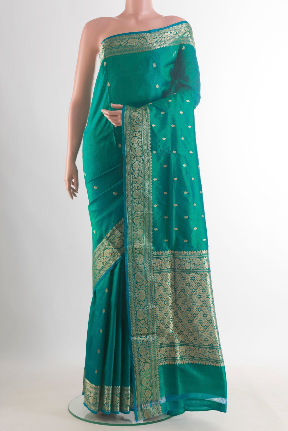 Pure Silk Green Banarasi Katan Saree with Zari Butta on the body and Zari Border.  displayed on a mannequin