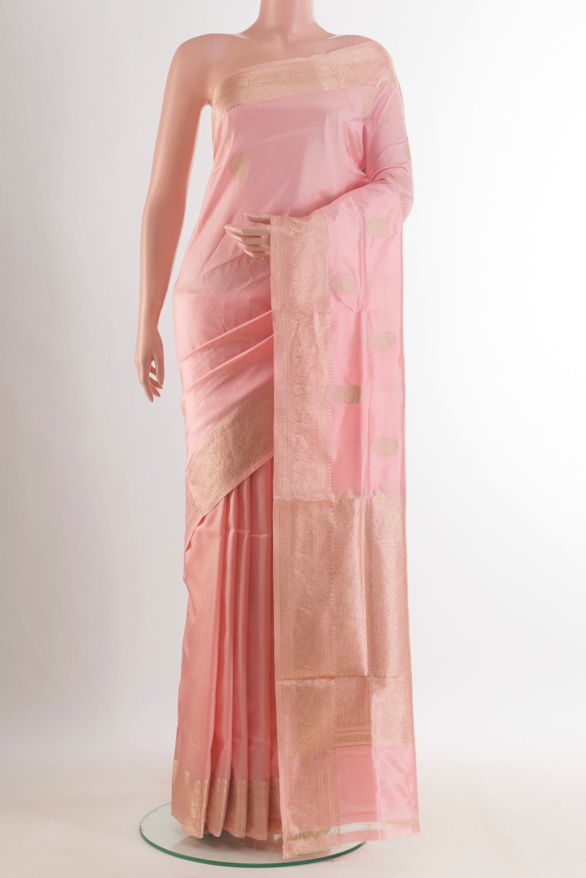 Pure Silk Peach Banarasi Katan Saree with Zari Butta on the body and Zari Border.  displayed on a mannequin