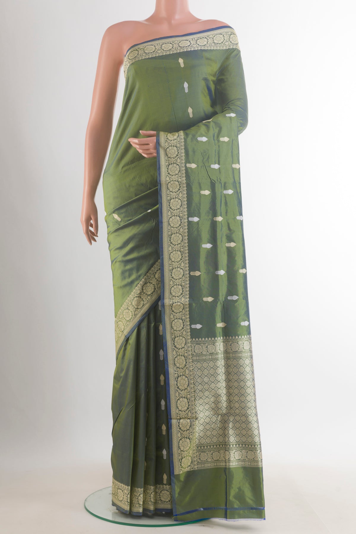 Pure Silk Green Dual Tone Banarasi Katan Saree with Thread Butta on the body and Thread Border.  displayed on a mannequin