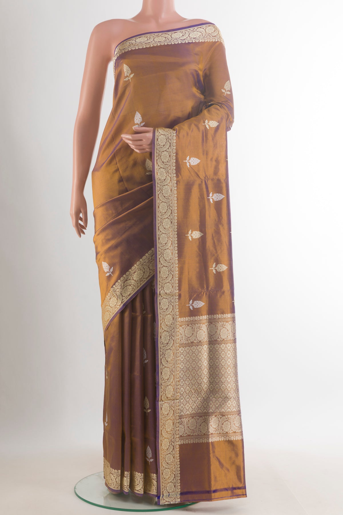 Pure Silk Bronze Dual Tone Banarasi Katan Saree with Thread Butta on the body and Thread Border.  displayed on a mannequin