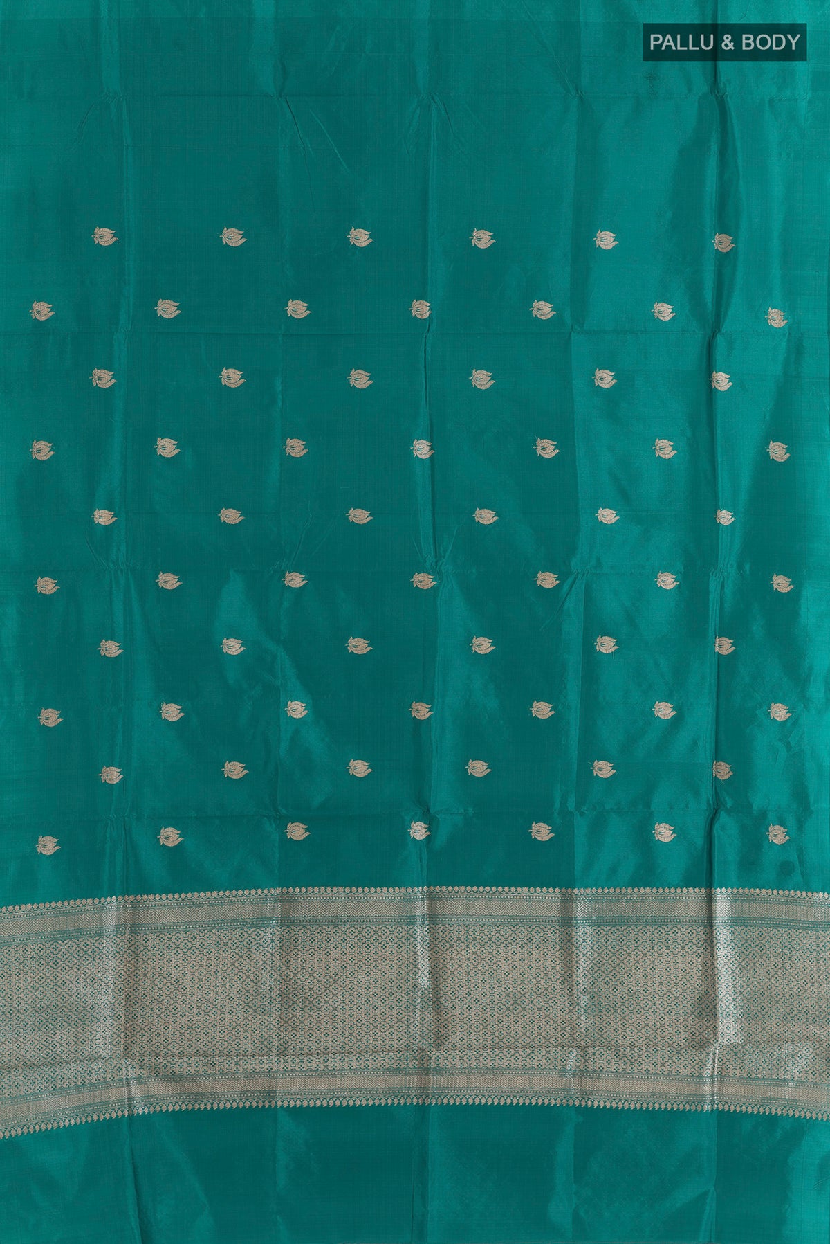 Flat view of Pure Silk Teal Banarasi Katan Saree with Zari Butta on the body and Without Border. 