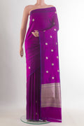 Pure Silk Purple Banarasi Katan Saree with Zari Butta on the body and Without Border.  displayed on a mannequin
