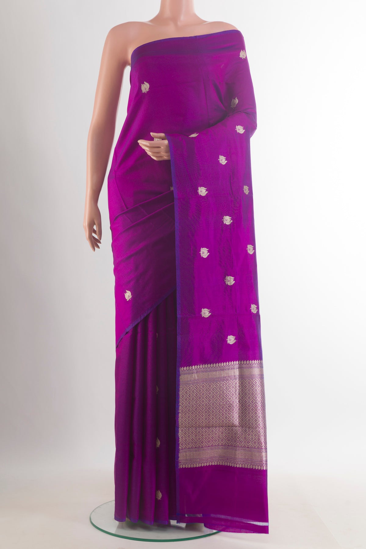 Pure Silk Purple Banarasi Katan Saree with Zari Butta on the body and Without Border.  displayed on a mannequin