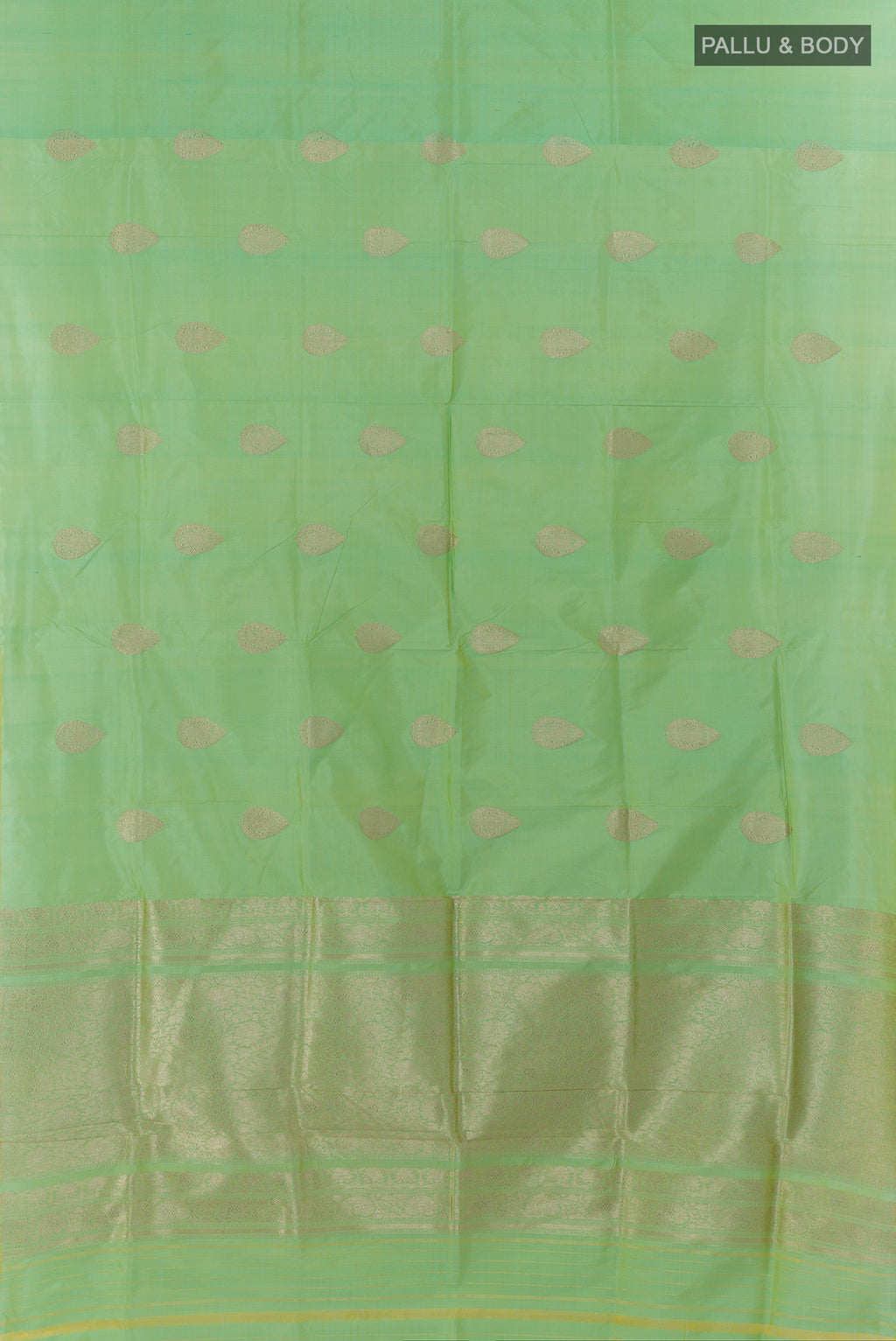 Flat view of Pure Silk Pista Green Banarasi Katan Saree with Zari Butta on the body and Without Border. 