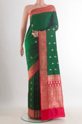 Pure Silk Green Banarasi Katan Saree with Zari Butta on the body and Zari Border.  displayed on a mannequin