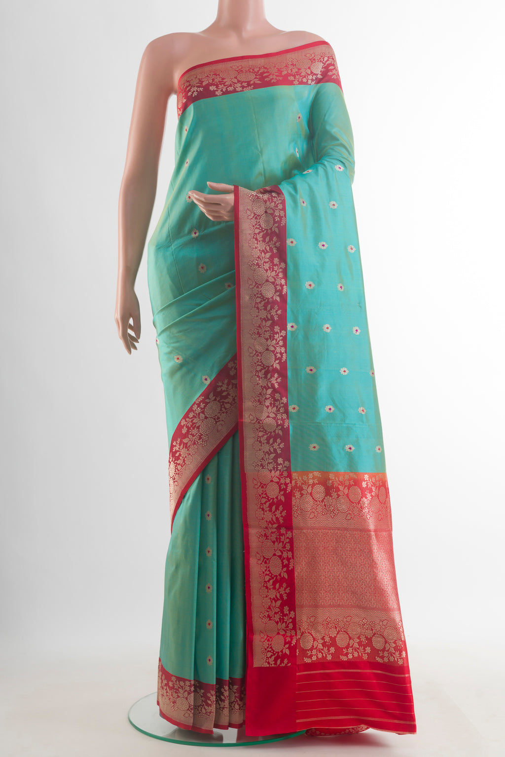 Pure Silk Sea Green Banarasi Katan Saree with Zari Butta on the body and Zari Border.  displayed on a mannequin