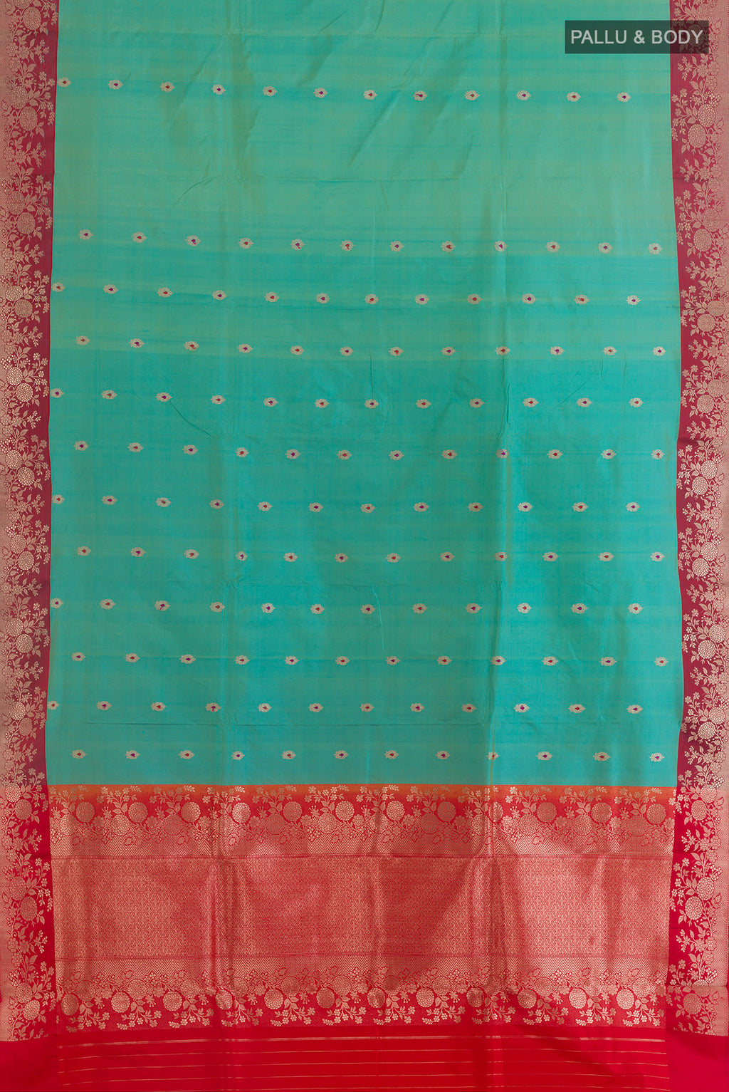 Flat view of Pure Silk Sea Green Banarasi Katan Saree with Zari Butta on the body and Zari Border. 
