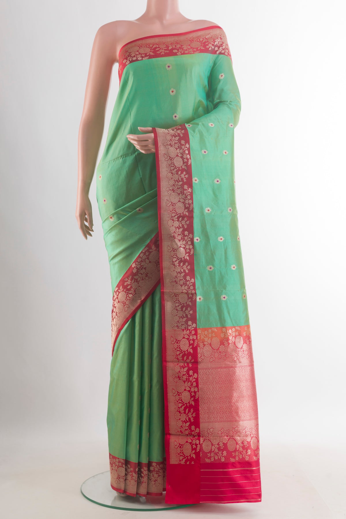 Pure Silk Green Banarasi Katan Saree with Zari Butta on the body and Zari Border.  displayed on a mannequin