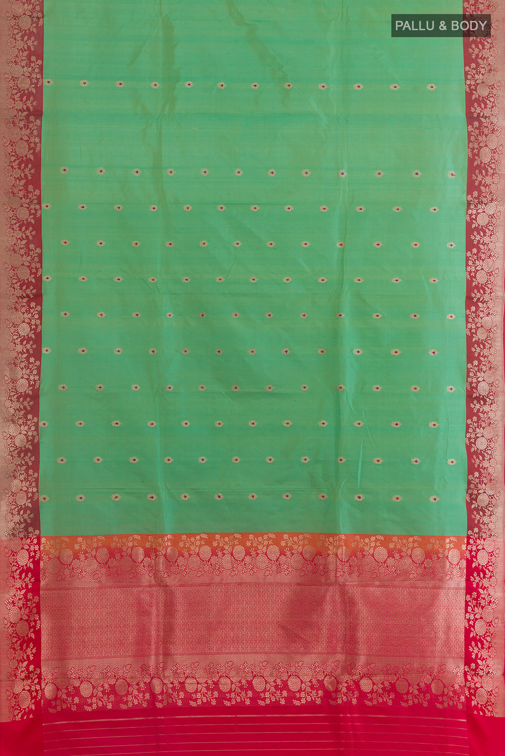 Flat view of Pure Silk Green Banarasi Katan Saree with Zari Butta on the body and Zari Border. 