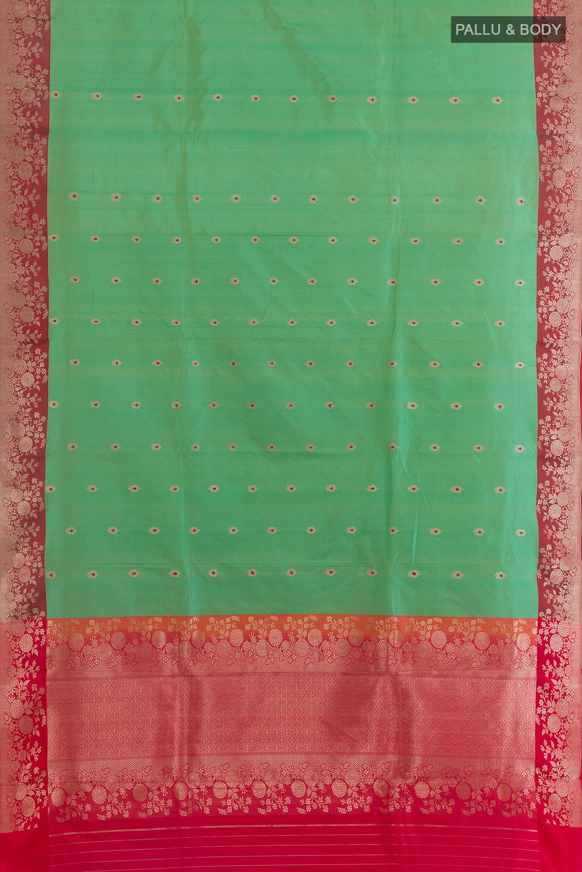 Flat view of Pure Silk Green Banarasi Katan Saree with Zari Butta on the body and Zari Border. 