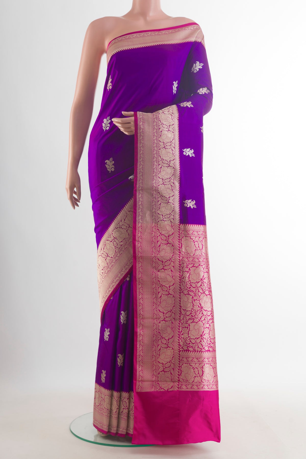 Pure Silk Purple Banarasi Katan Saree with Zari Butta on the body and Zari Border.  displayed on a mannequin