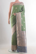 Pure Silk Sage Green Banarasi Katan Saree with Zari Butta on the body and Zari Border.  displayed on a mannequin