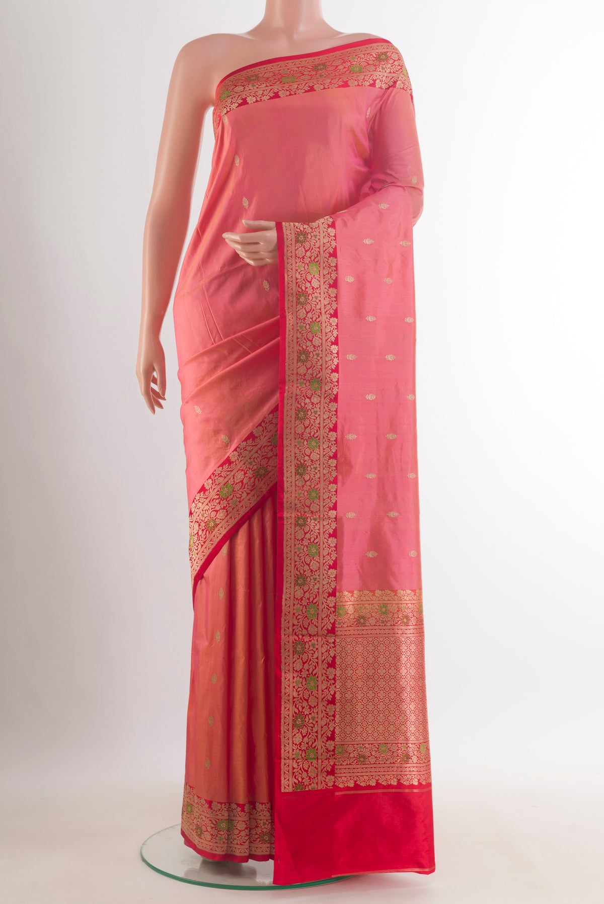 Pure Silk Peach Banarasi Katan Saree with Zari Butta on the body and Zari Border.  displayed on a mannequin