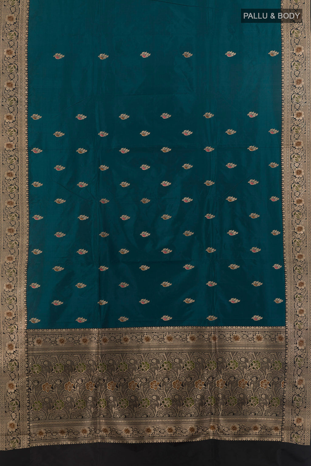 Flat view of Pure Silk Blue Soft Saree with Zari Butta on the body and Zari Border. 