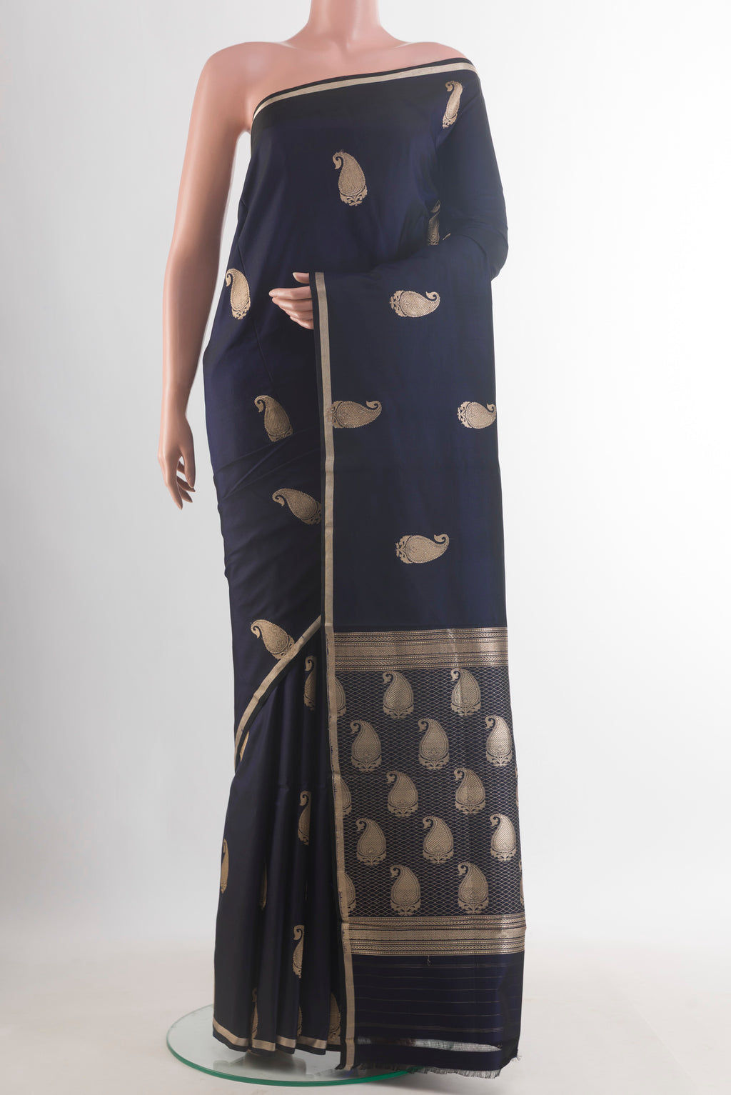 Navy Blue Banarasi Saree with Zari Butta on the body and Zari Border.  displayed on a mannequin