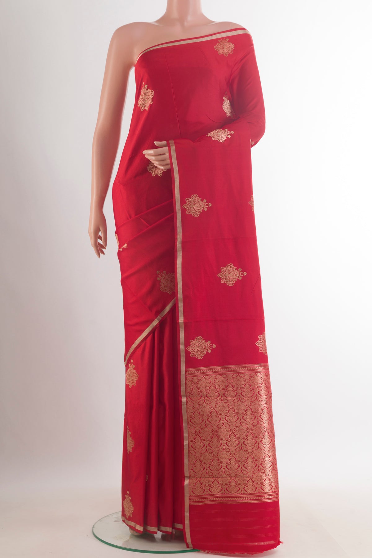 Red Banarasi Saree with Zari Butta on the body and Zari Border.  displayed on a mannequin