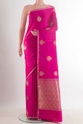 Pink Banarasi Saree with Zari Butta on the body and Zari Border.  displayed on a mannequin