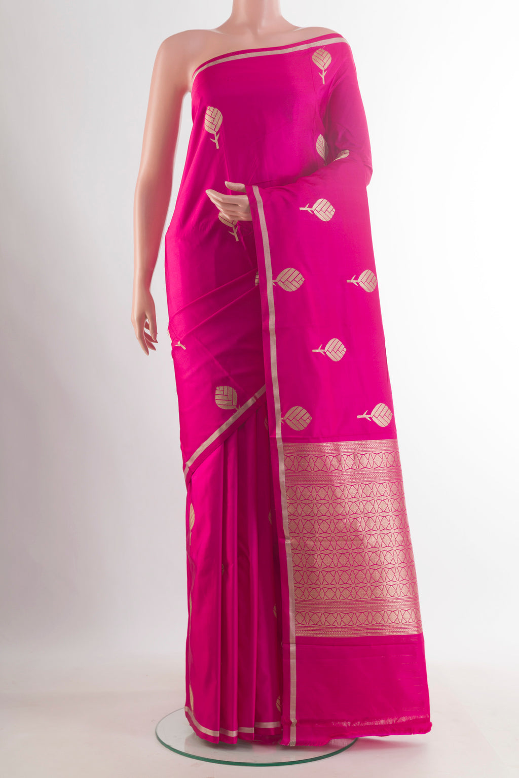Pink Banarasi Saree with Zari Butta on the body and Zari Border.  displayed on a mannequin