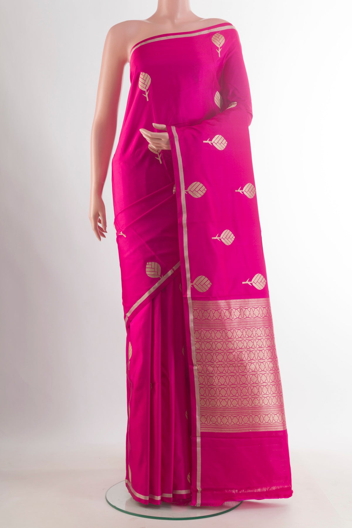 Pink Banarasi Saree with Zari Butta on the body and Zari Border.  displayed on a mannequin