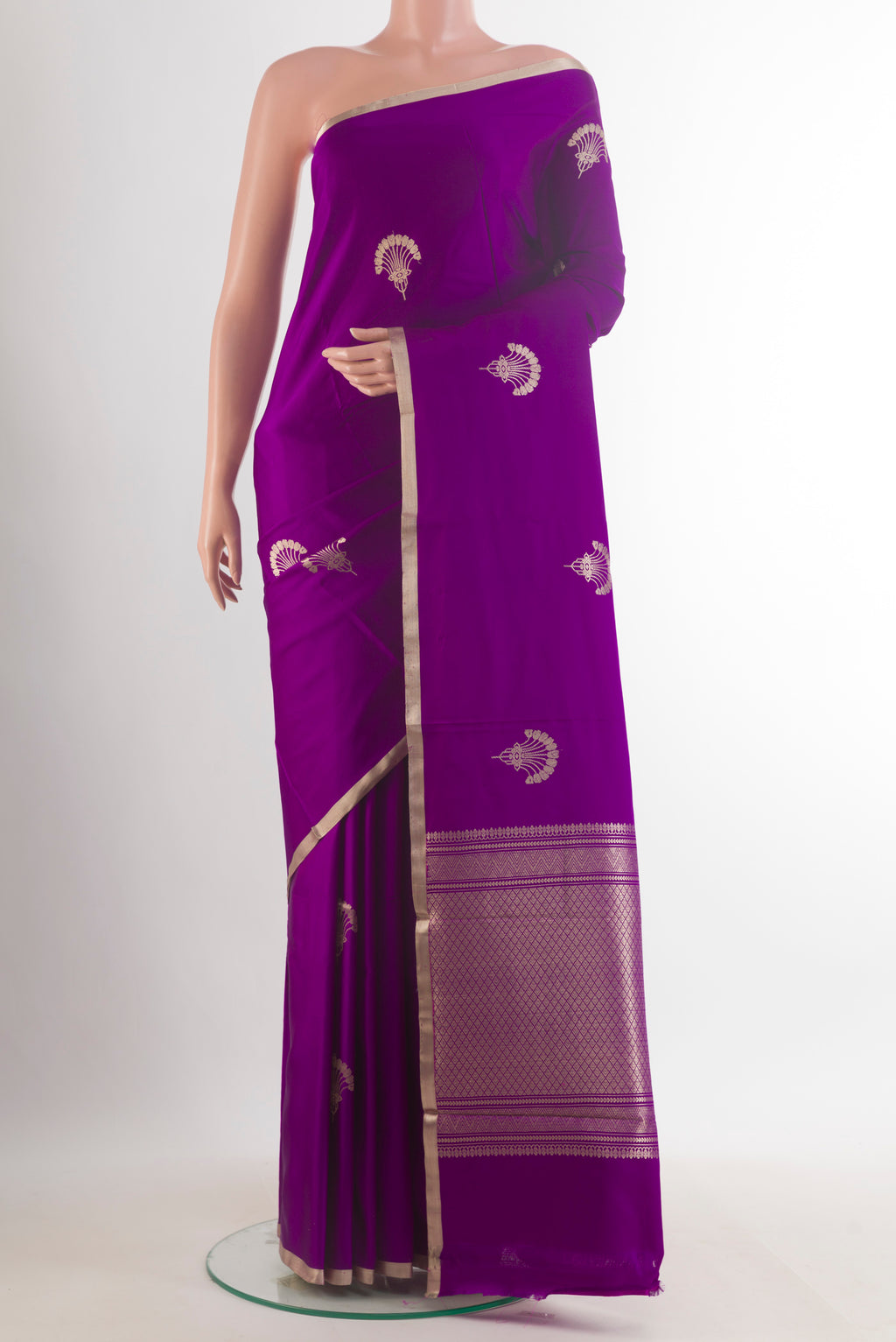 Purple Banarasi Saree with Zari Butta on the body and Zari Border.  displayed on a mannequin