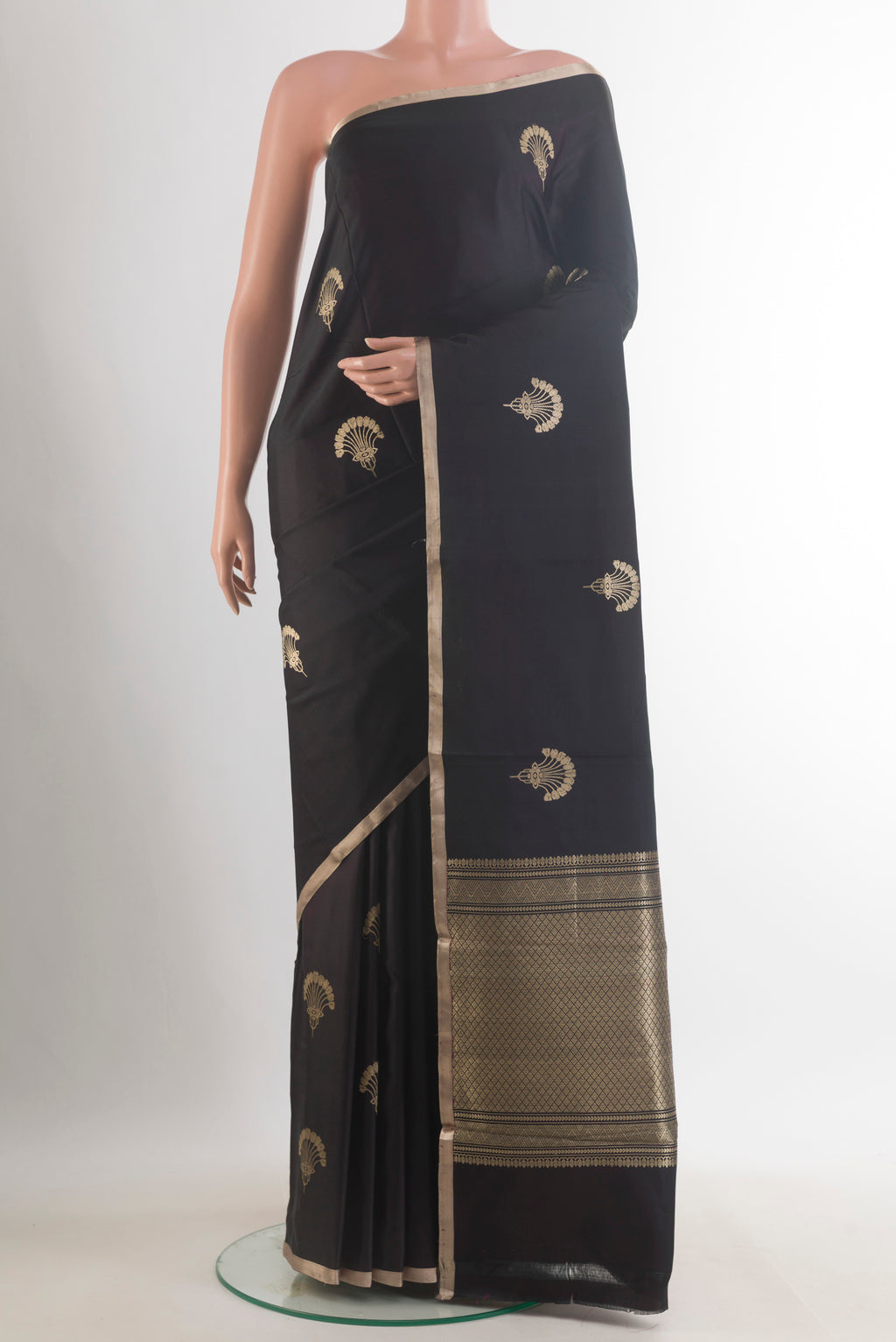 Black Banarasi Saree with Zari Butta on the body and Zari Border.  displayed on a mannequin
