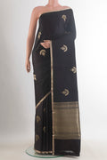 Black Banarasi Saree with Zari Butta on the body and Zari Border.  displayed on a mannequin