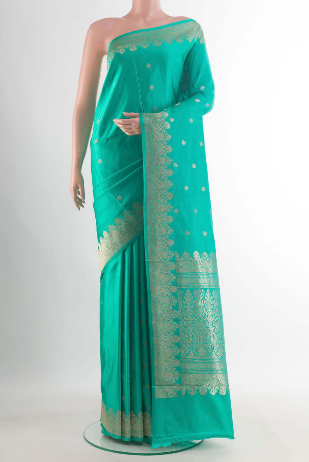 Pure Silk Turquoise Banarasi Katan Saree with Zari Butta on the body and Zari Border.  displayed on a mannequin