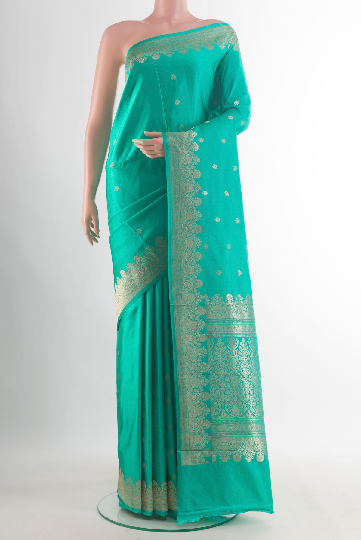 Pure Silk Turquoise Banarasi Katan Saree with Zari Butta on the body and Zari Border.  displayed on a mannequin