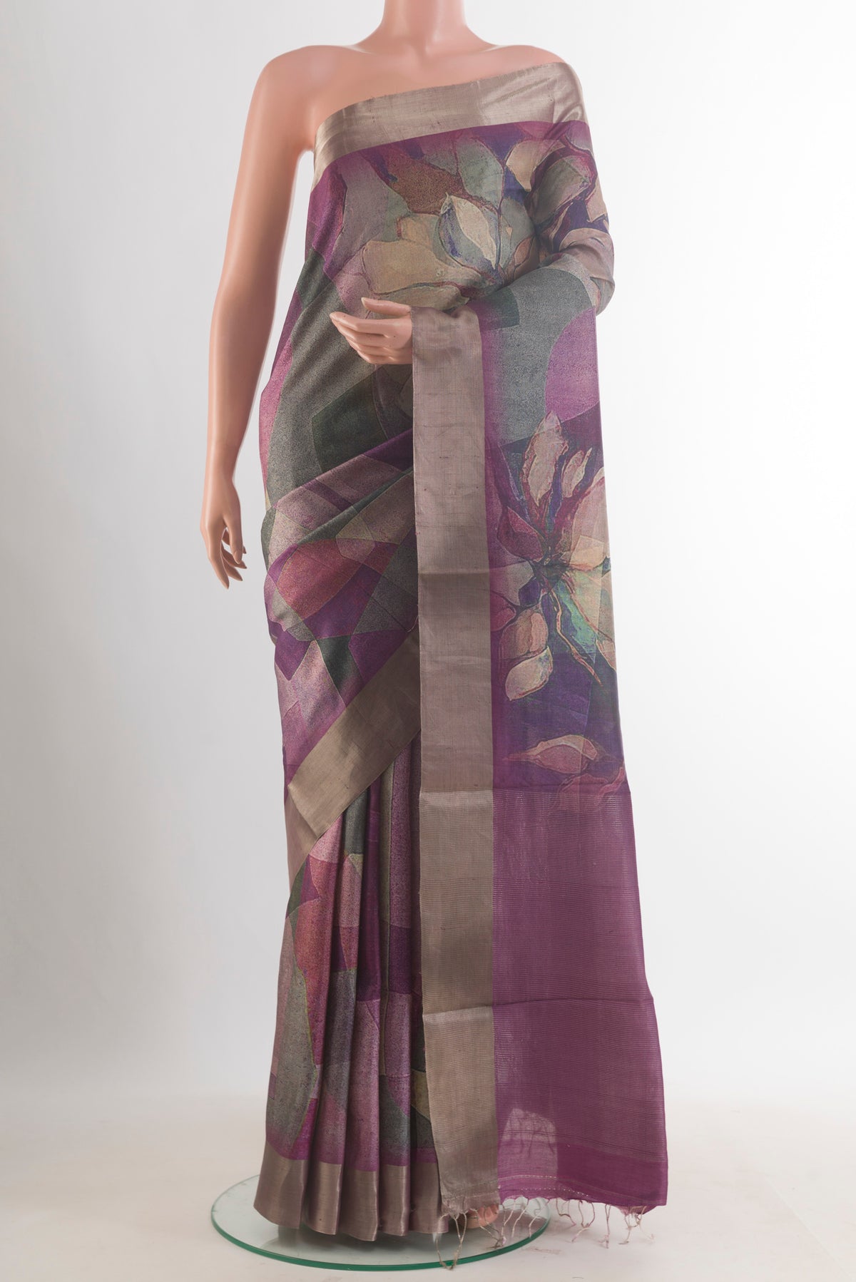 Purple Tussar Saree with Printed design on the body and Zari Border.  displayed on a mannequin
