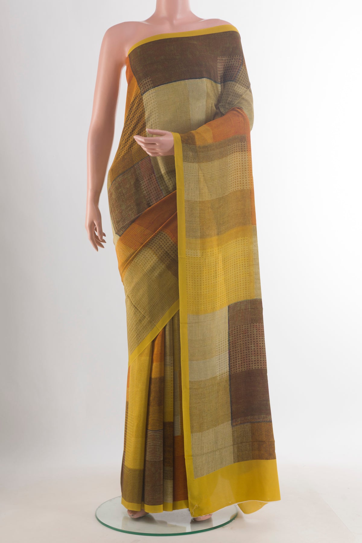 Yellow Mysore Crepe Saree with Printed design on the body and Plain Border.  displayed on a mannequin