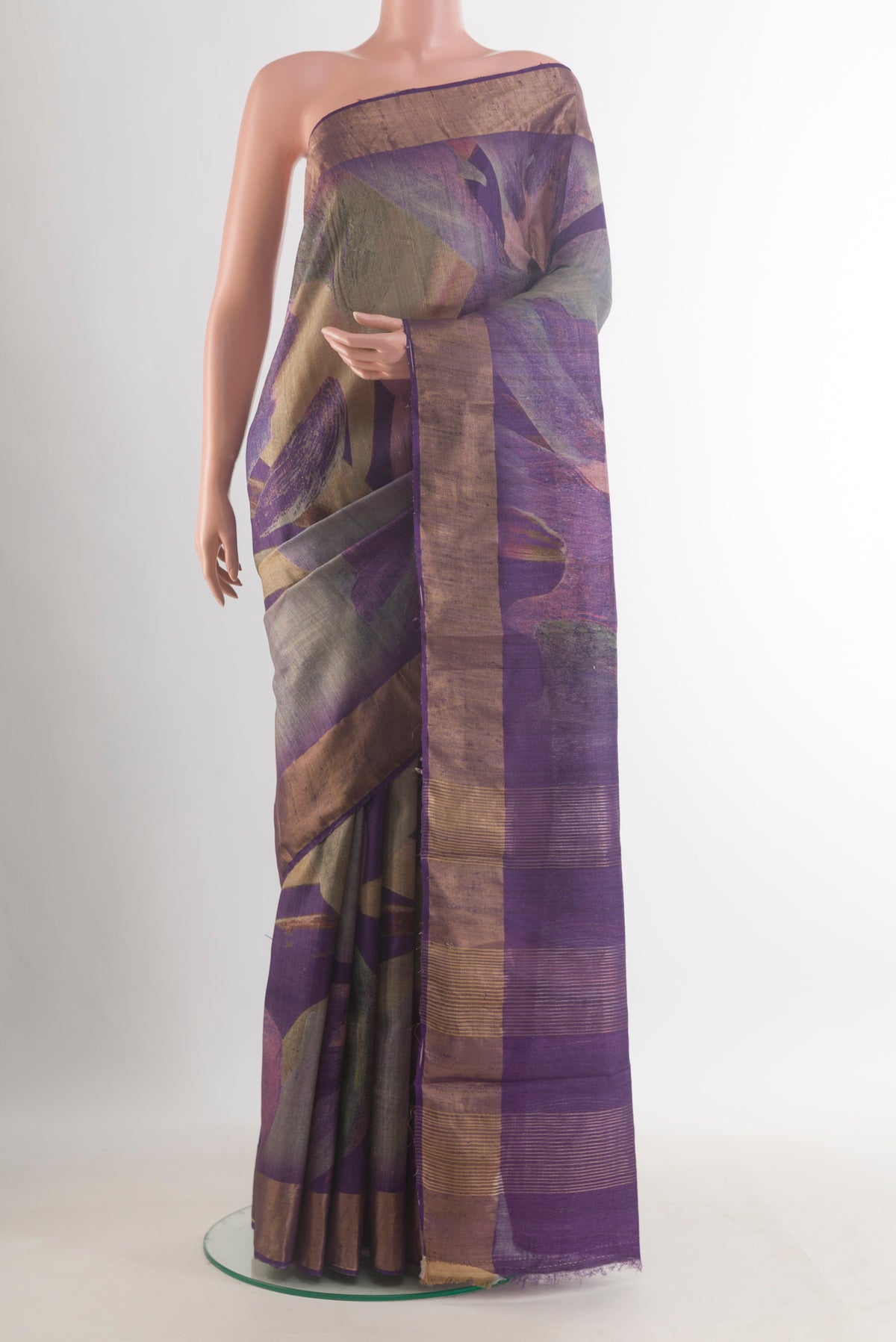 Purple Tussar Saree with Printed design on the body and Zari Border.  displayed on a mannequin