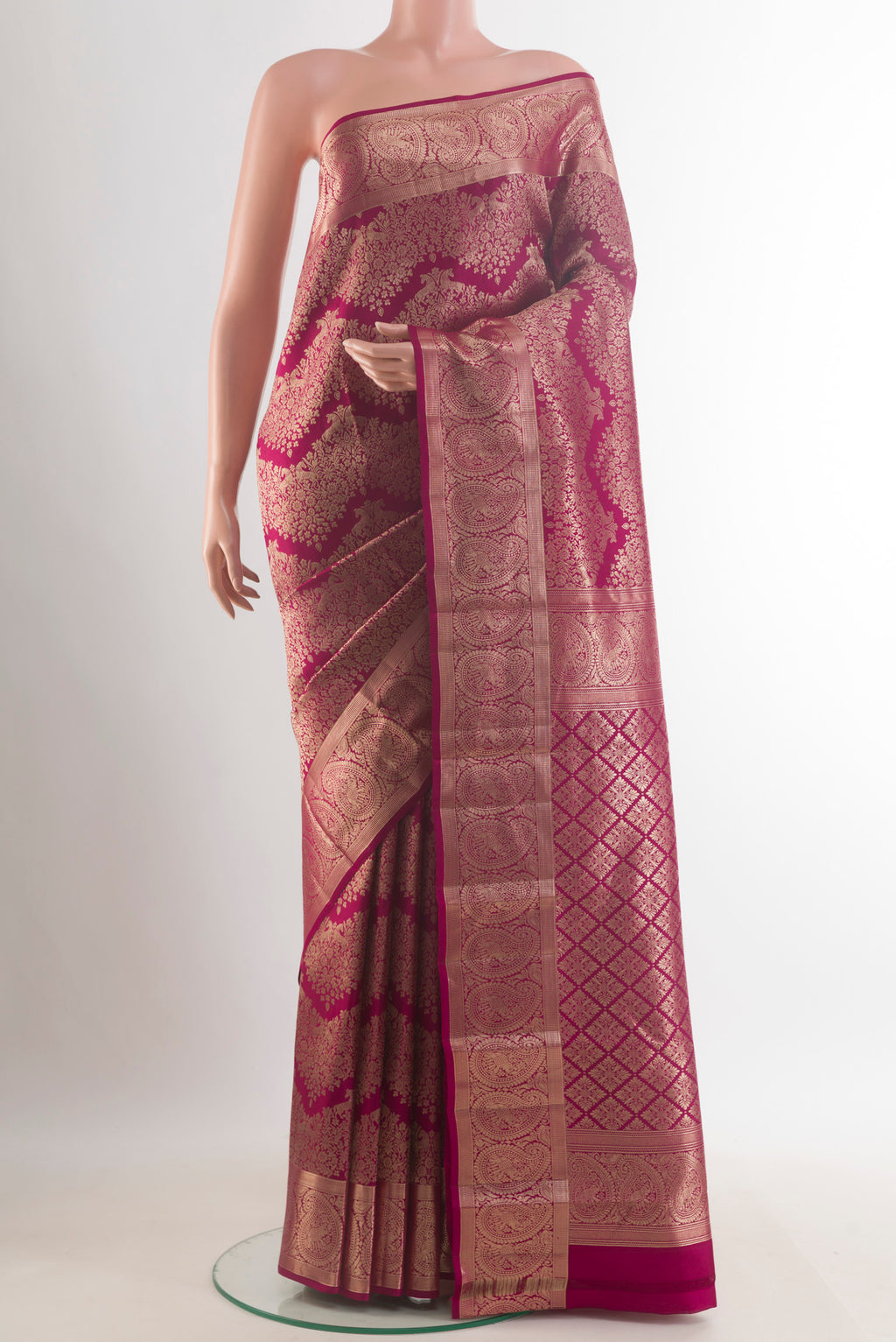 Pure Silk Maroon Kanchipuram Saree with Zari Brocade on the body and Zari Border.  displayed on a mannequin