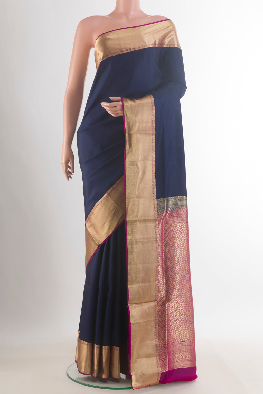 Pure Silk Navy Blue Soft Saree with Plain Body and Zari Border.  displayed on a mannequin