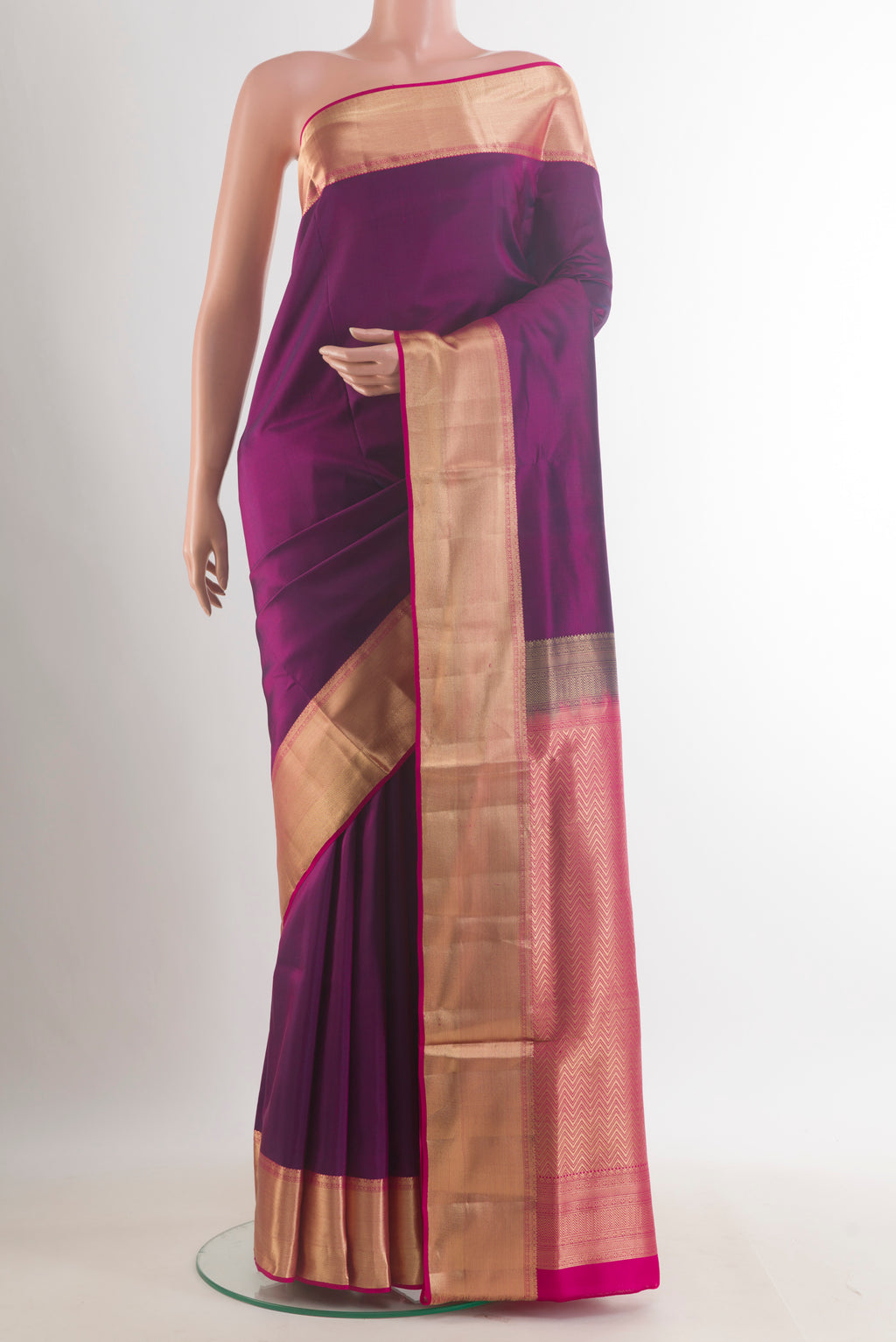 Pure Silk Purple Soft Saree with Plain Body and Zari Border.  displayed on a mannequin
