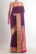Pure Silk Purple Soft Saree with Plain Body and Zari Border.  displayed on a mannequin