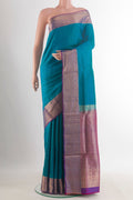 Pure Silk Blue Soft Saree with Plain Body and Zari Border.  displayed on a mannequin