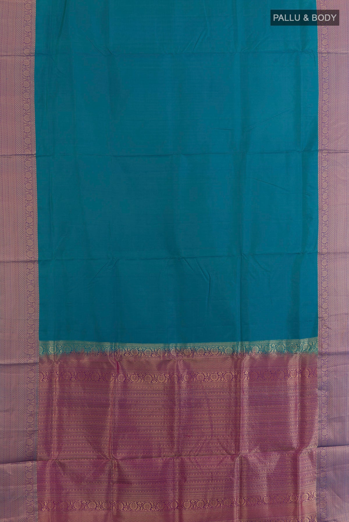 Flat view of Pure Silk Blue Soft Saree with Plain Body and Zari Border. 