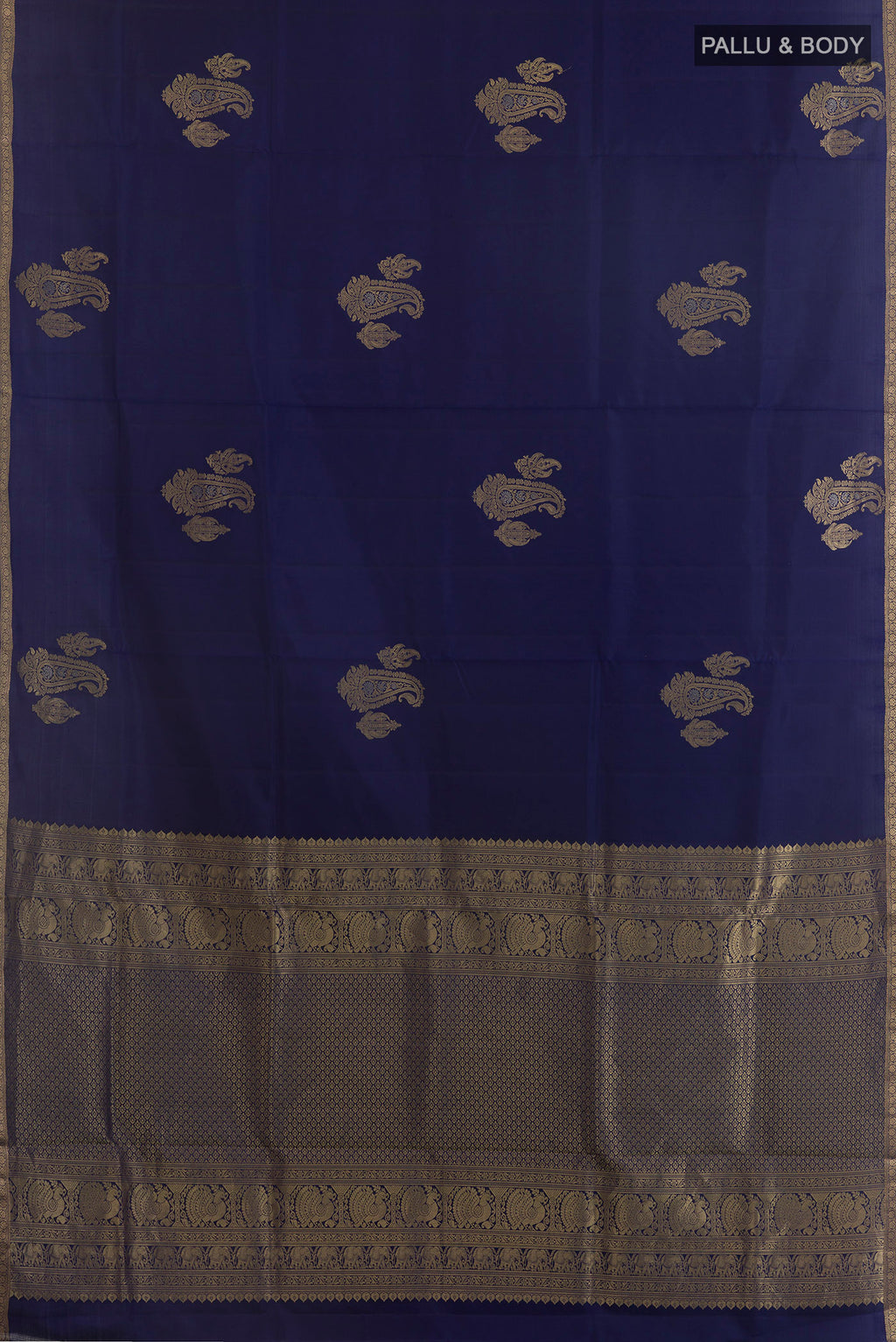 Flat view of Pure Silk Navy Blue Soft Saree with Zari Butta on the body and Zari Border. 