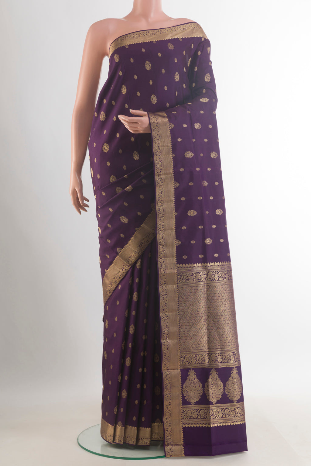 Pure Silk Purple Soft Saree with Zari Butta on the body and Zari Border.  displayed on a mannequin