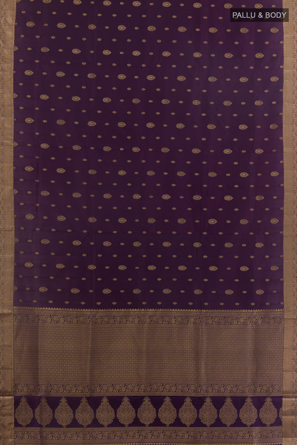 Flat view of Pure Silk Purple Soft Saree with Zari Butta on the body and Zari Border. 