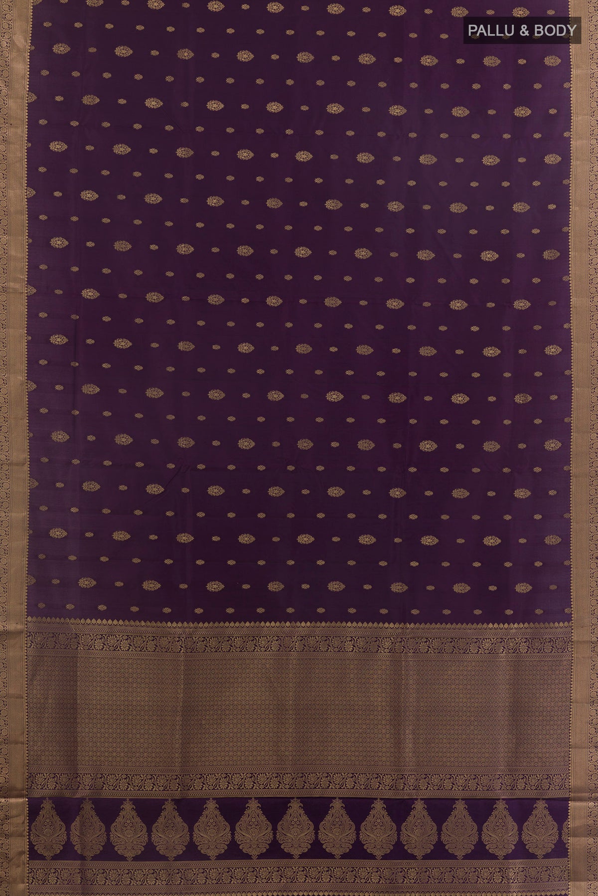 Flat view of Pure Silk Purple Soft Saree with Zari Butta on the body and Zari Border. 