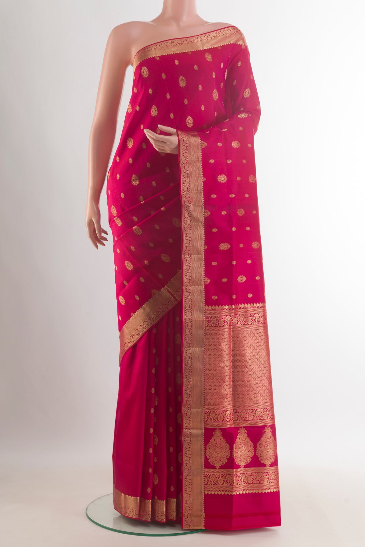 Pure Silk Red Soft Saree with Zari Butta on the body and Zari Border.  displayed on a mannequin