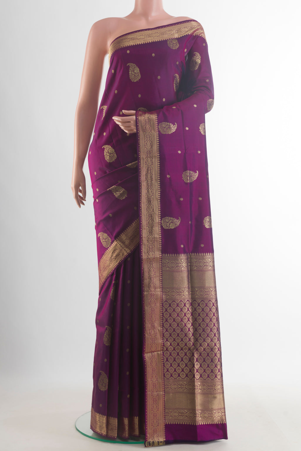 Pure Silk Purple Soft Saree with Zari Butta on the body and Zari Border.  displayed on a mannequin
