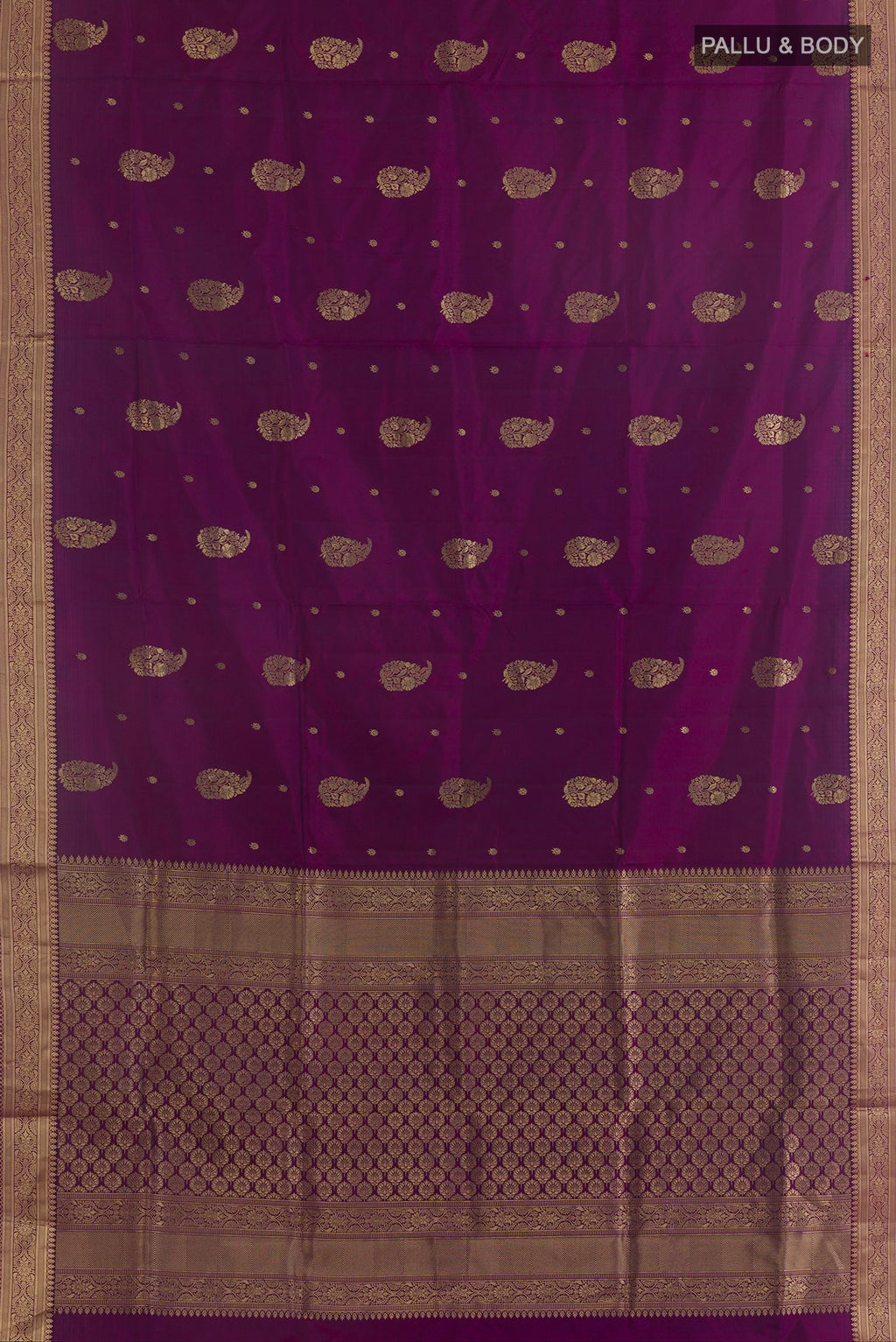Flat view of Pure Silk Purple Soft Saree with Zari Butta on the body and Zari Border. 