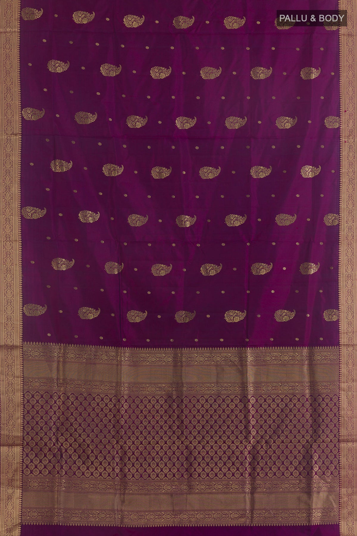 Flat view of Pure Silk Purple Soft Saree with Zari Butta on the body and Zari Border. 
