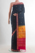 Pure Silk Black Soft Saree with Zari Butta on the body and Zari Border.  displayed on a mannequin