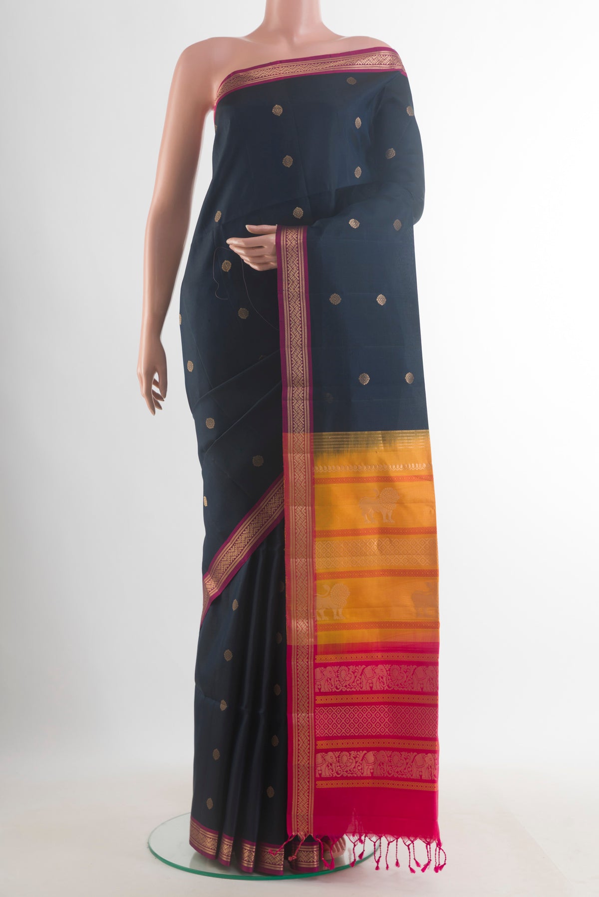 Pure Silk Black Soft Saree with Zari Butta on the body and Zari Border.  displayed on a mannequin