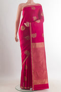 Pure Silk Pink Kanchipuram Saree with Zari Butta on the body and Zari Border.  displayed on a mannequin