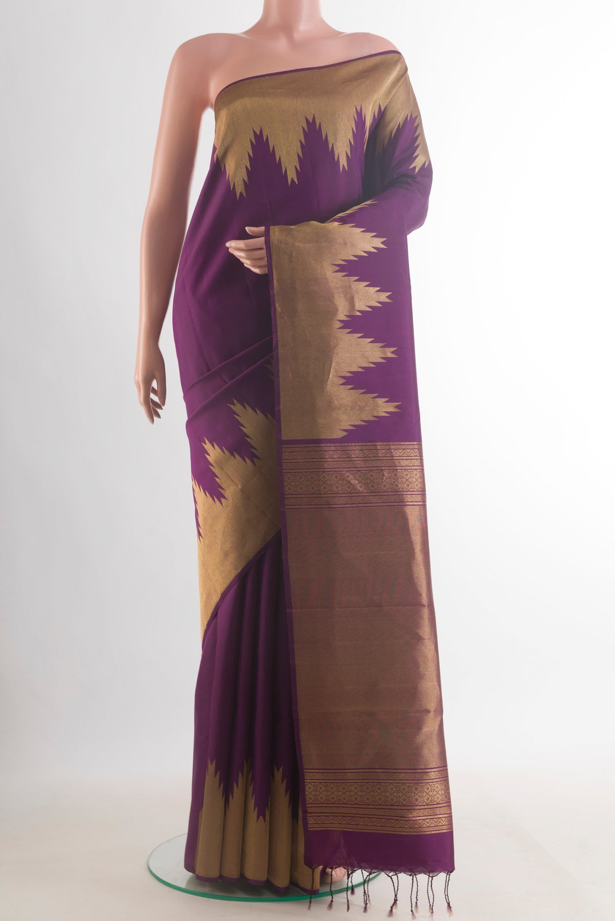 Pure Silk Purple Kanchipuram Saree with Plain Body and Temple Border.  displayed on a mannequin