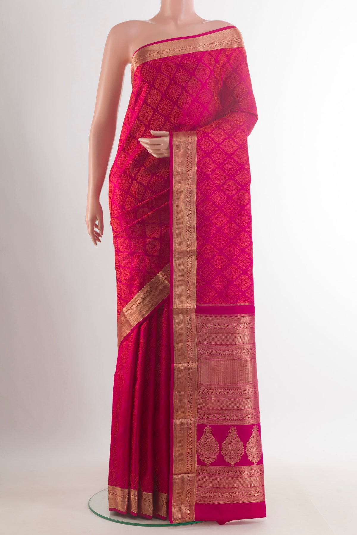 Pure Silk Dark Pink Kanchipuram Saree with Jacquard design on the body and Zari Border.  displayed on a mannequin